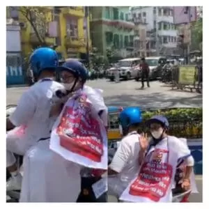 Mamta Banerjee rides electric scooter